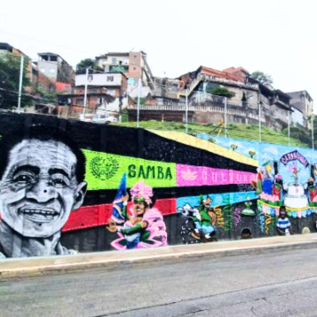 grafite em muro com imagem dos cardeais do samba