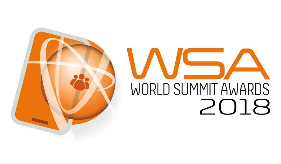 Em um fundo branco, o logotipo do prêmio WSA - um celular com um mundo e conexões - em cor laranja. Ao lado, o texto WSA: World Summit Awards 2018