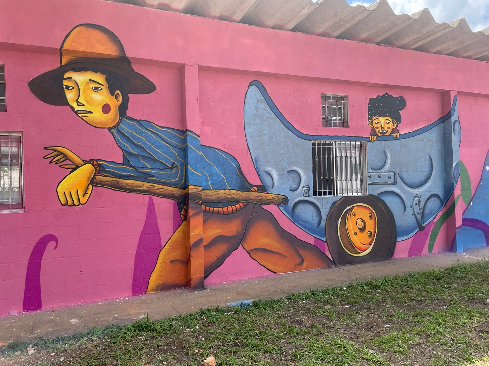 Grafite de Ludu retrata padrasto carregando carroça que ele recolhia recicláveis