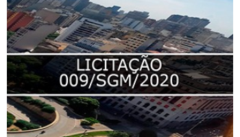 Fotografia que mostra o shopping Light, no fundo vários prédios da cidade de São Paulo e no meio faixa escrito Licitação 009/SGM/2020