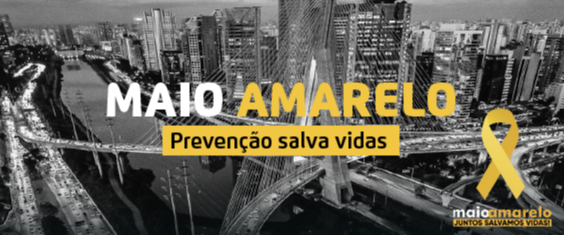 Em fundo preto e branco está a ponte estaiada da cidade de São Paulo, com prédios ao redor. Em amarelo, branco e preto, está escrito "Maio Amarelo: prevenção salva vidas".
