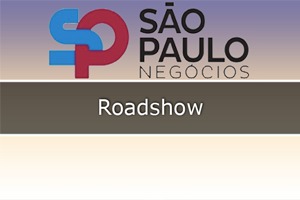 Imagem com cor clara escrito no meio Roadshow e em cima simbolo SPNegócio