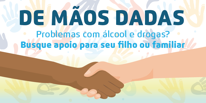 A arte apresenta duas mãos dadas de etnias diferentes e a mensagem 